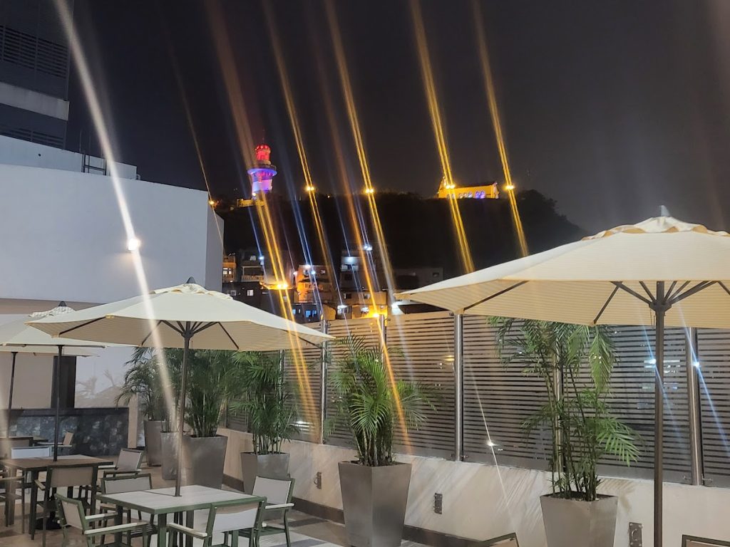 View from the rooftop pool at the Wyndam in Guayaquil, Ecador with the hillside lights in the distance and the city below