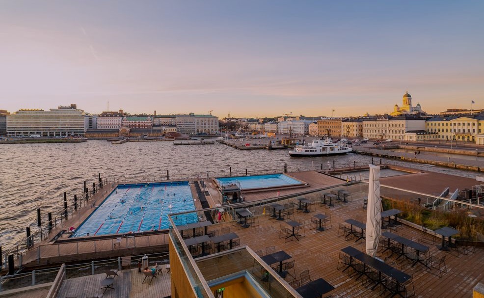 Allas sea spa pools and water as night is falling in secret saunas of Helsinki