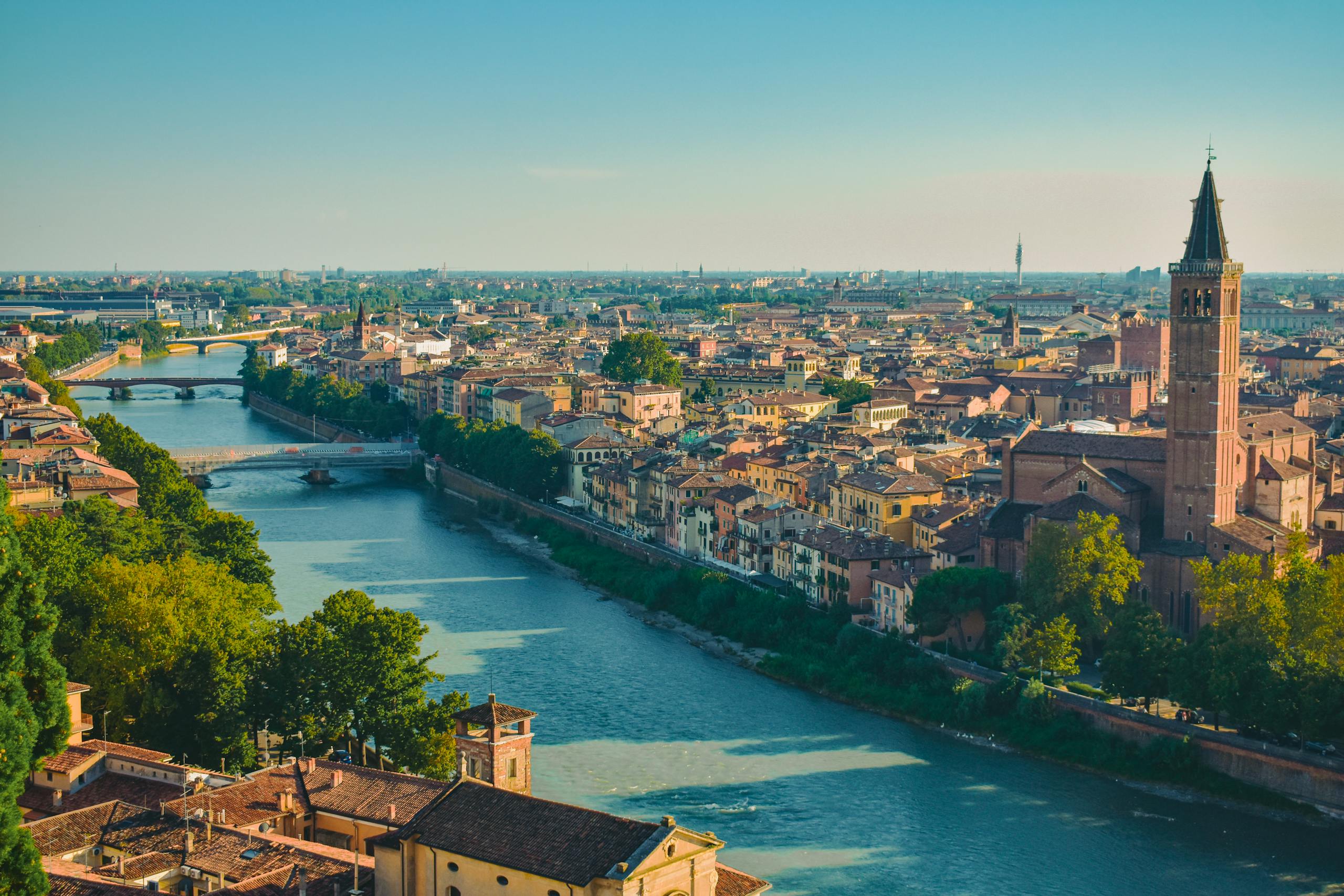 Romantic things to do in Verona, Italy, captured from above with its architectural landmarks and winding river.