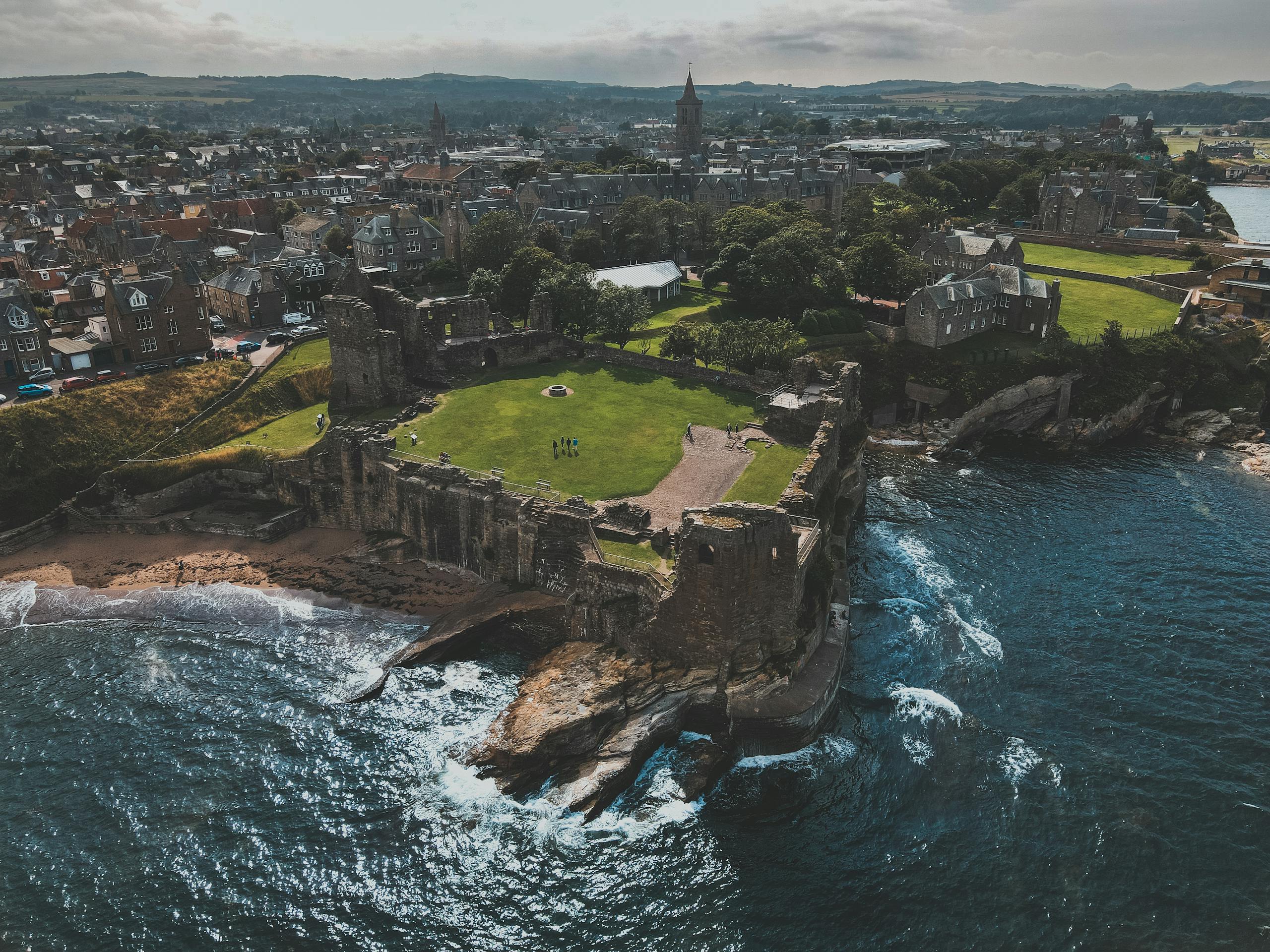 Scenic aerial shot of historic St Andrews Castle overlooking the North Sea in Scotland in the 10 best day trips from Edinburgh