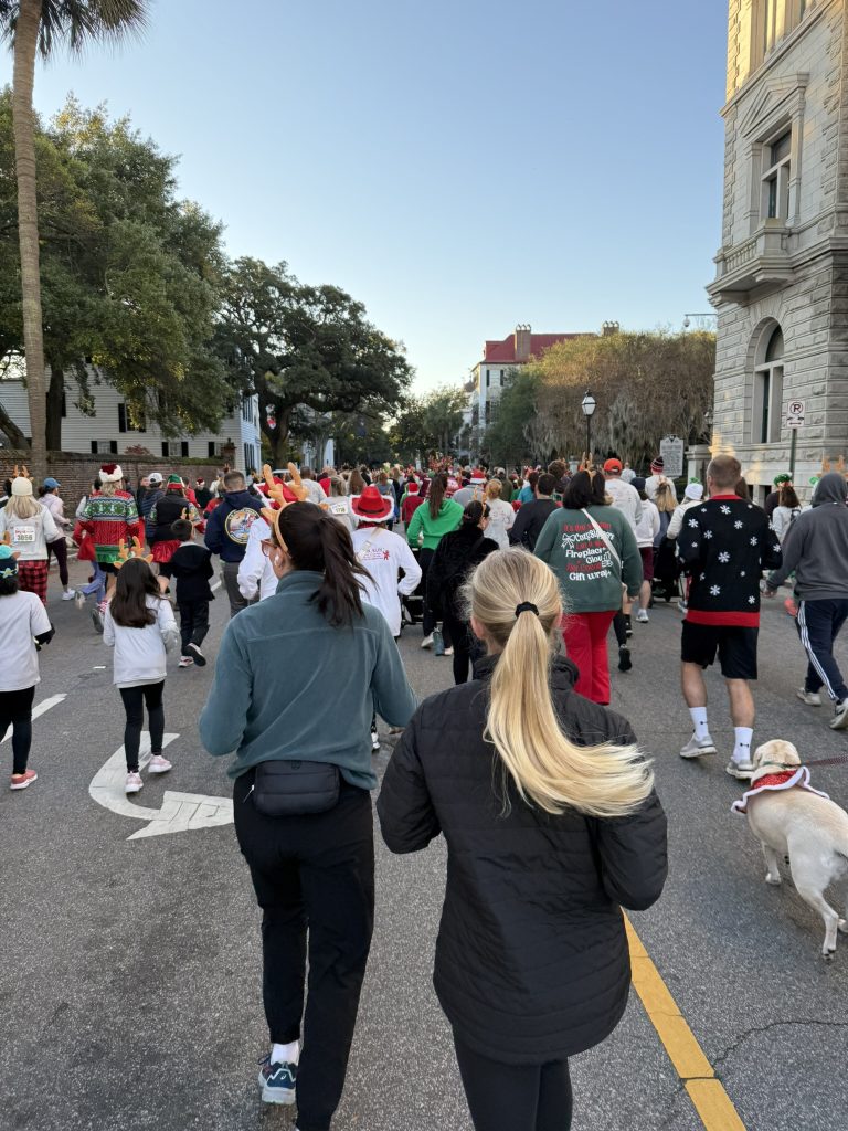 A crowd of people running and walking during the Reindeer Run in downtown Charleston, SC in Charleston holiday runs