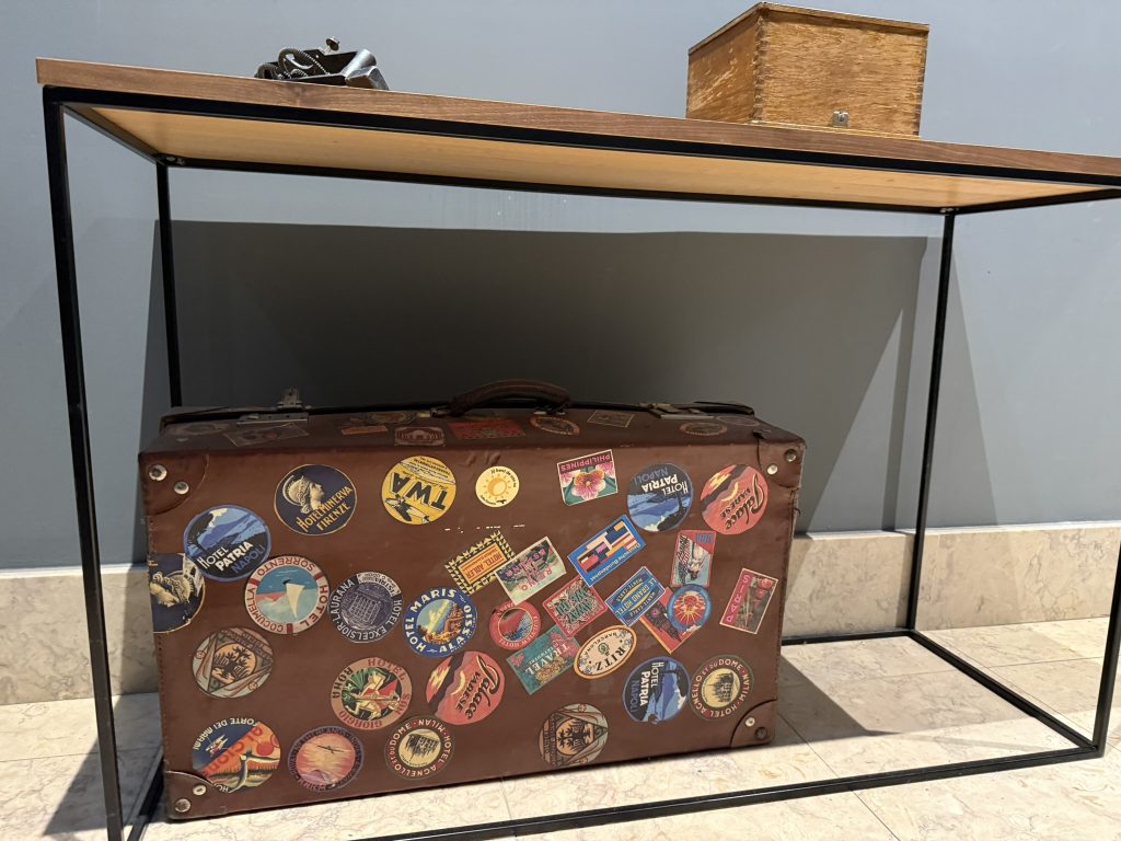 Old suitcase under a table as part of the decor at the Editory Riverside Santa Apolonia Hotel in Lisbon, Portugal