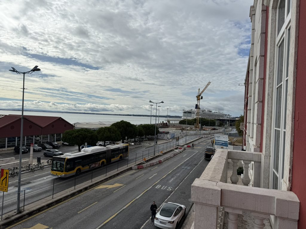View of the water and road from a balcony at the Editory Riverside Santa Apolonia Hotel in Lisbon, Portugal