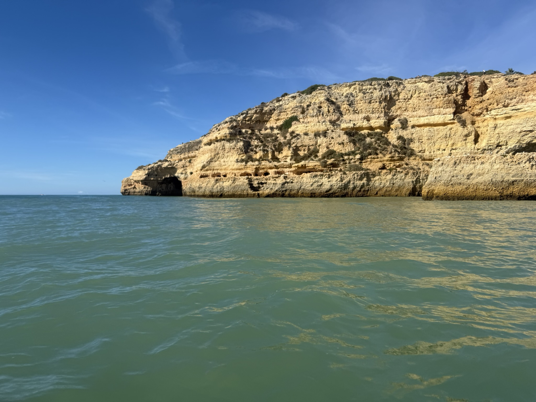 View of the Benagil cave and cliff wall as seen from a kayak in the ocean during spring break in the Algarve, Porgutal