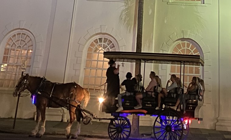 Carriage ride on Broad Street in Charleston, SC in the evening as seen on spring break in Charleston