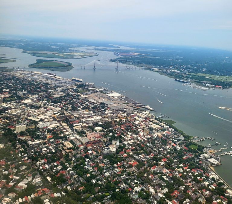 View of Charleston as we are flying over head to land at the airport. you can see an arial image of downtown as well as the Copper River Bridge from above as we are about to go on spring break in Charleston