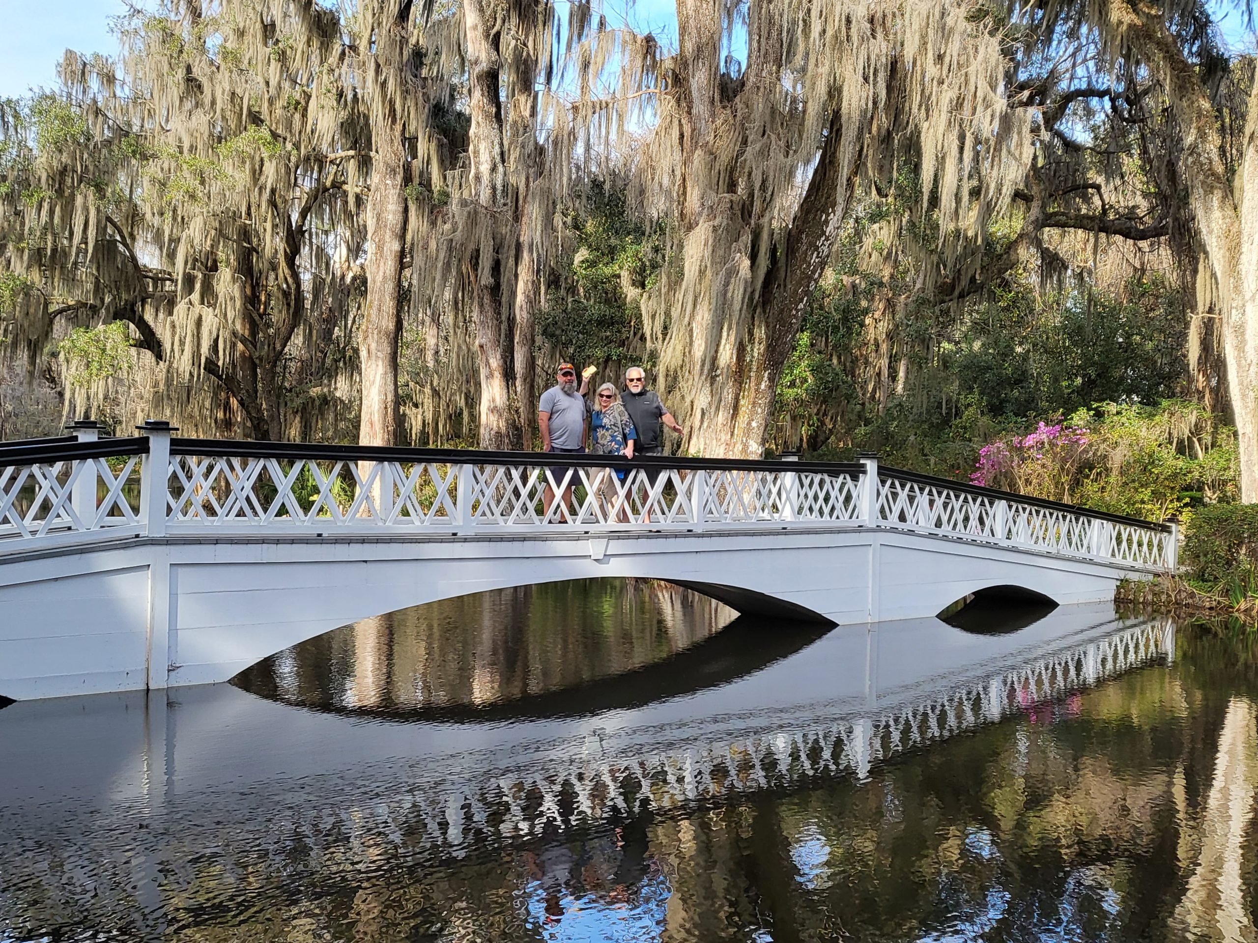 Beautiful white bridge over a pond during spring break in Charleston at Magnolia Plantation