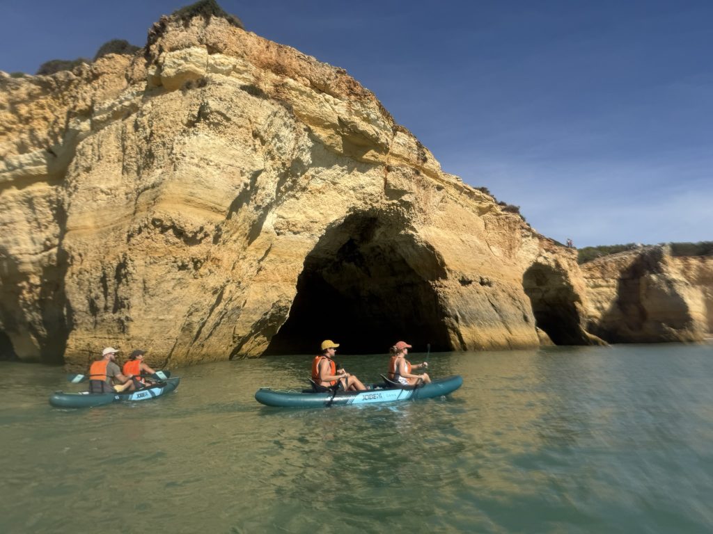 Kayakers in the sea in Algarve, Portugal outside of the Benagil Cliffs in best Algarve resorts