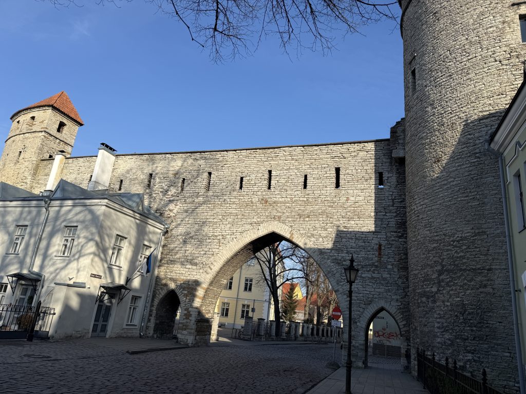 Arched entryway into the medieval stone wall to enter into the Old Town section of Tallinn, Estonia. We saw this doing the 2 days in Tallinn Itinerary