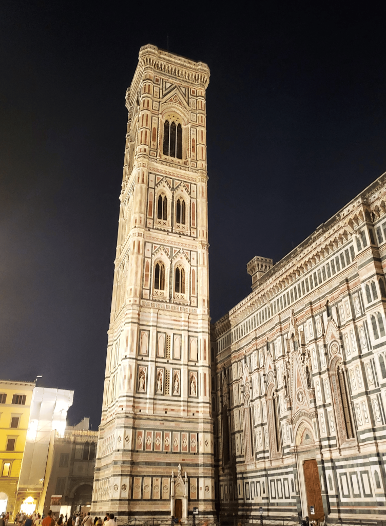 Walking through Florence, Italy on an excursion to see the hidden gems of Florence we came across the Giotto which is an old tower that looked almost white against the night sky.