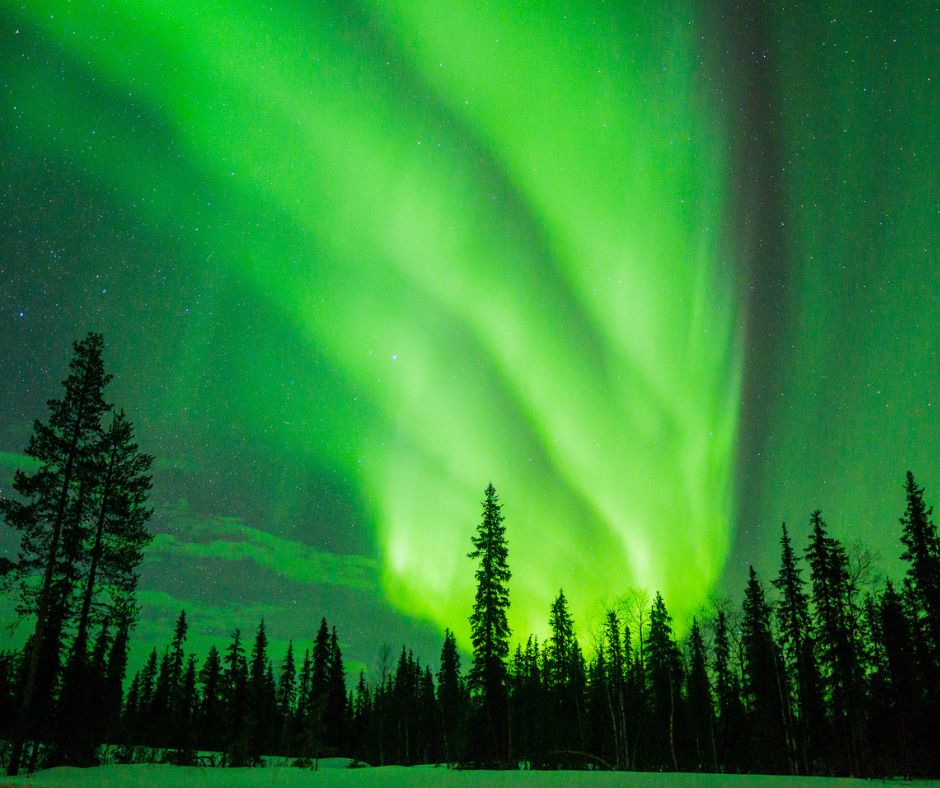 Beautiful electric green Northern Lights as seen in March in Lapland