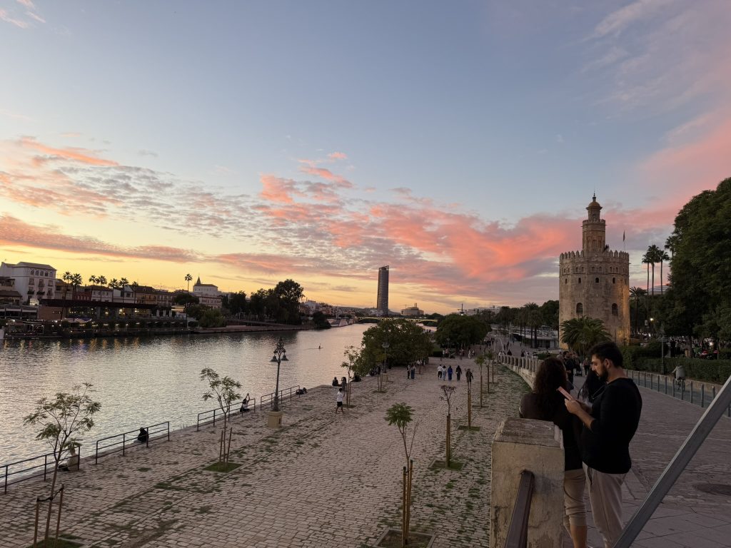 As seen in travel tips, the river in Seville Spain as the sun is setting.
