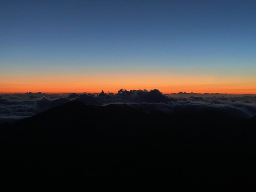 In 3 days in Maui watching the sunrise above the clouds in Haleakalā National Park in Maui, Hawaii