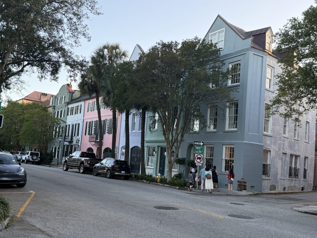 Brightly colors old houses at the start of Rainbow Row on East Bay Street in Charleston, South Carolina