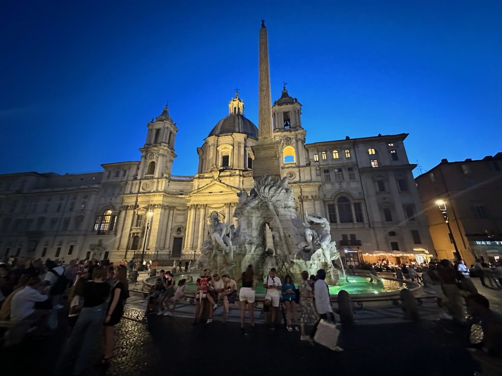 Piazza Navona in Rome, Italy on a hot evening with a beautiful clear sky.