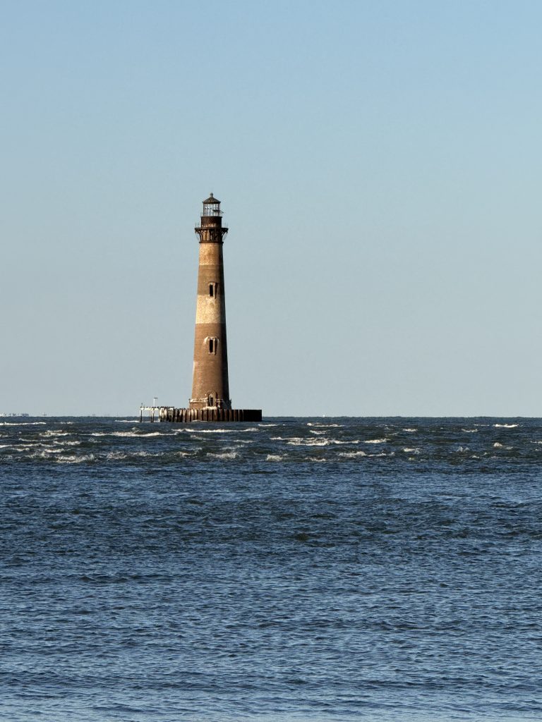Morris Island Light house as seen off of the end of Folly Beach near Charleston, SC