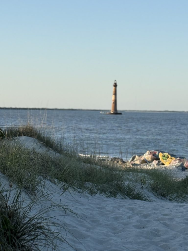 Morris Light House as seen from the inlet preserve on the edge of Folly Beach near Charleston, SC.