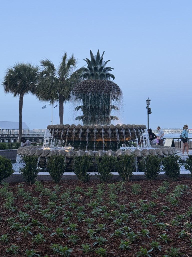 Things to know before visiting Charleston, SC, this is the Pineapple Fountain in waterfront Park in Charleston as the sun is setting