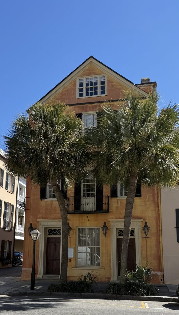 In determing where to stay in Charleston I walked by this classic pastel yellow Charlestonian house with 2 palm trees in front of it.