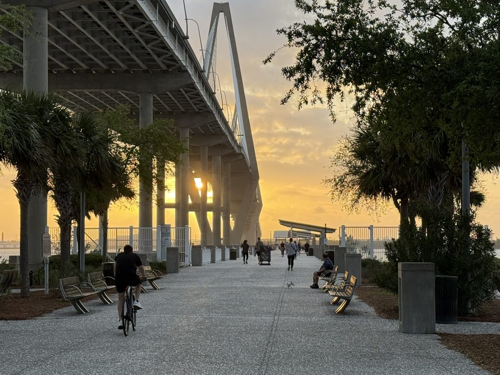 As seen from Mount Pleasant looking toward Charleston, South Carolina, the Ravenal Bridge as the sun is starting to set near Charleston, SC