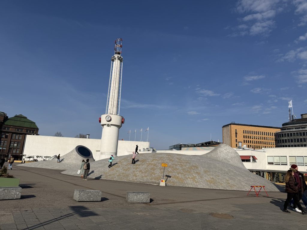 The plaza above Amos Rex, an art museum in Helsinki known for its underground exhibition halls topped by that distinctive undulating, dome-studded roof in Helsinki, Finland