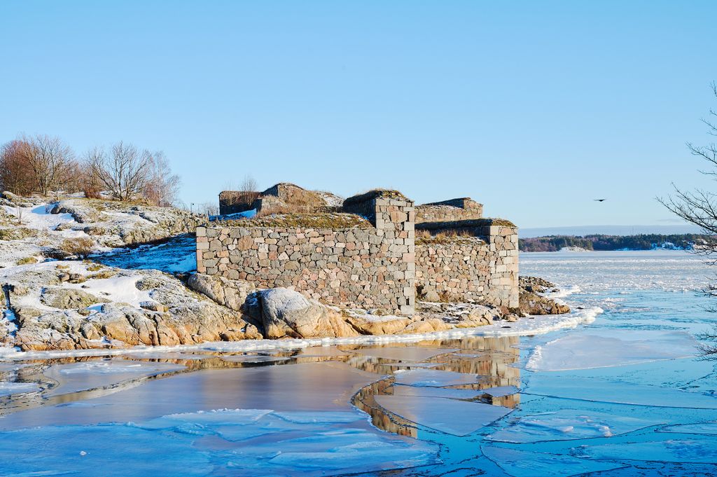 Scenic winter view of Suomenlinna fortress with icy landscape in Helsinki, Finland.