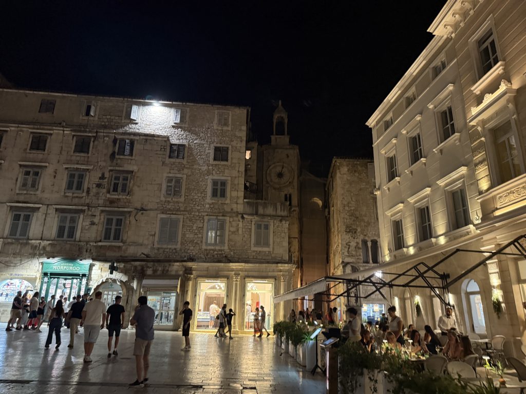 People's Square (Pjaca) in Split at night with its clock tower and candlelit café tables