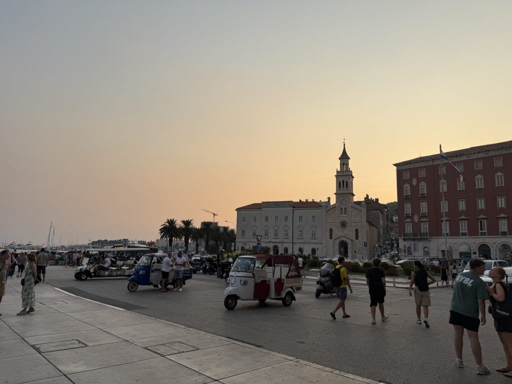 Tuk tuks parked on the Riva at sunset in front of the Church of St. Francis in Split
