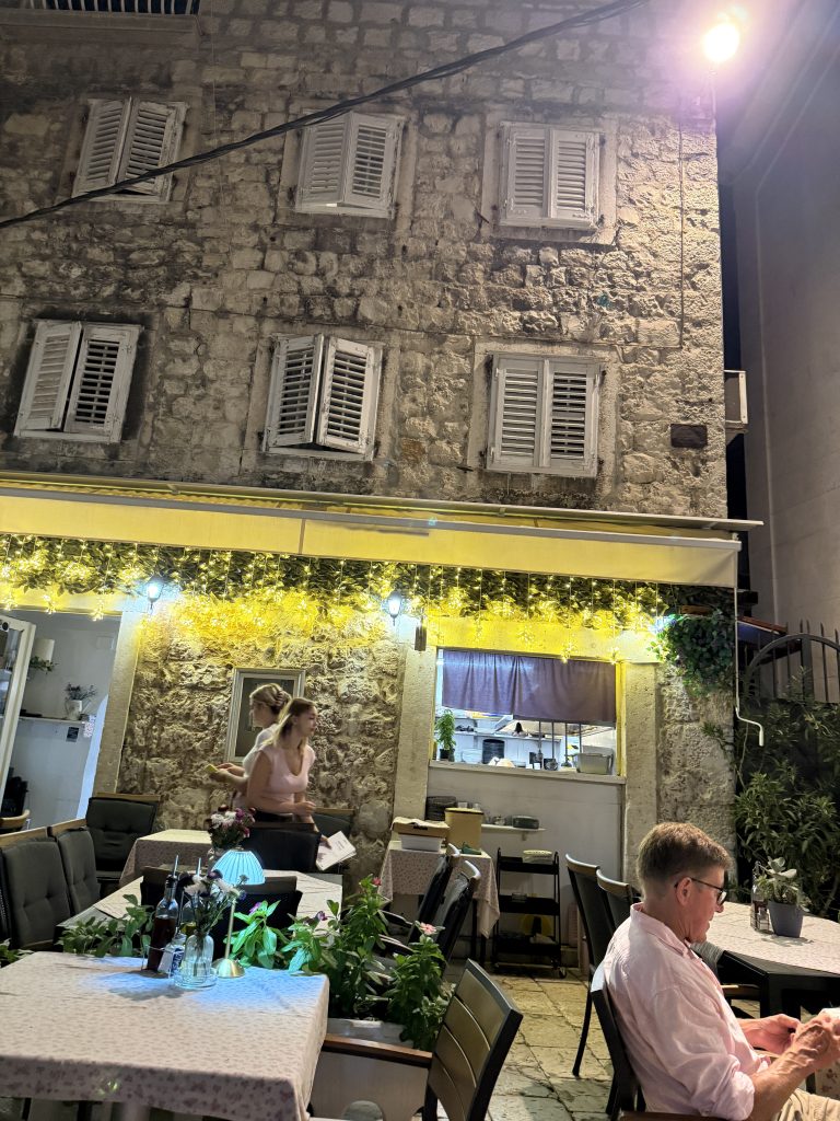 Quiet outdoor courtyard tables with fairy lights at Restaurant La Mia Storia in Split