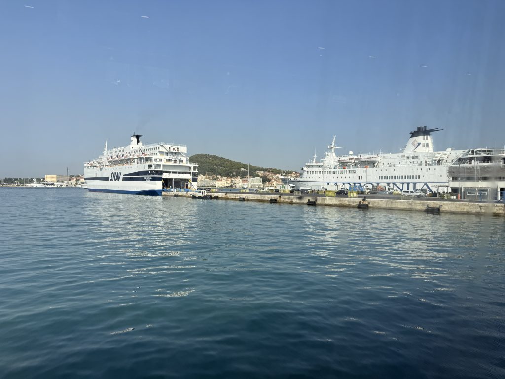 Large SNAV and Jadrolinija ferries docked at Split port, seen from the window of our Hvar catamaran