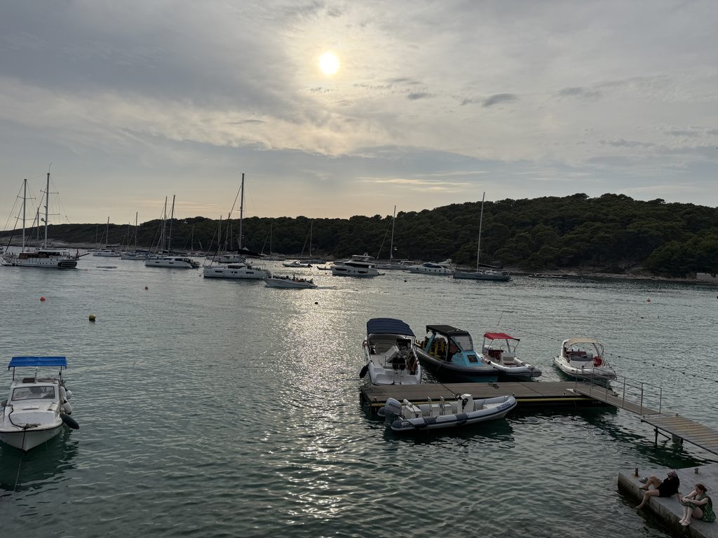 Vinogradišće Bay harbor as the sun starts to get lower in the sky, at a stop on a Blue Cave tour from Hvar